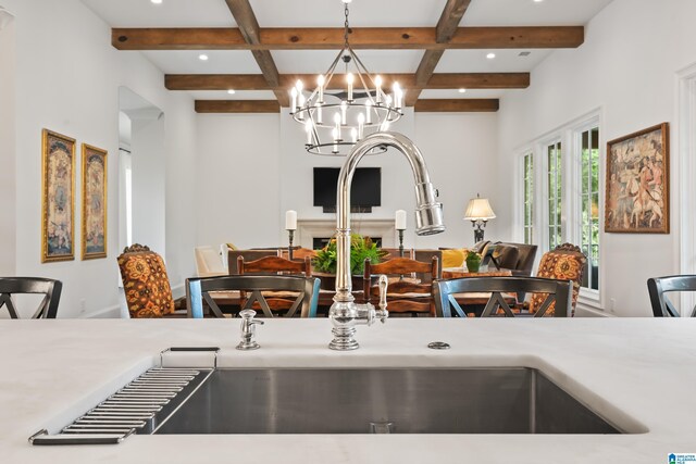 kitchen with white cabinetry, a breakfast bar area, sink, and custom exhaust hood