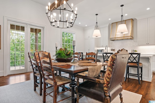 dining area featuring a chandelier and dark hardwood / wood-style flooring