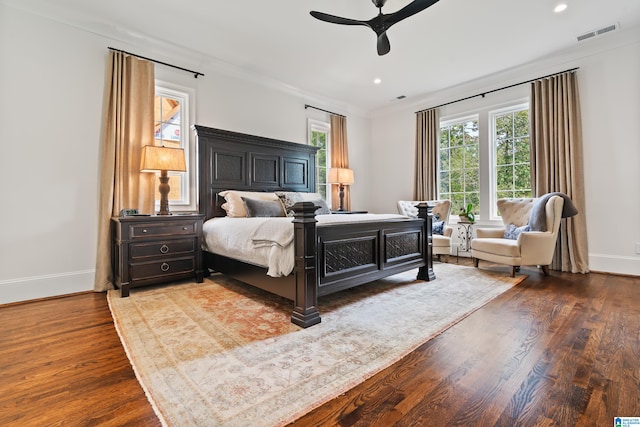 bedroom with ceiling fan and hardwood / wood-style flooring