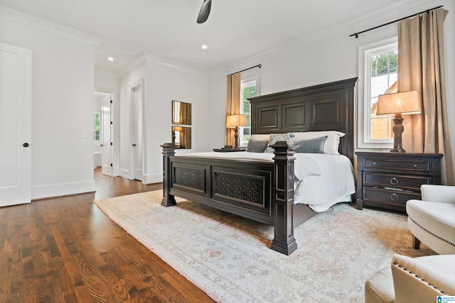 bedroom with crown molding, ceiling fan, and hardwood / wood-style flooring