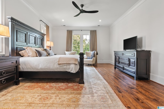 bedroom with ornamental molding, ceiling fan, and hardwood / wood-style floors