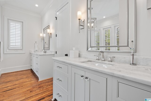 bathroom featuring wood-type flooring, vanity, and ceiling fan