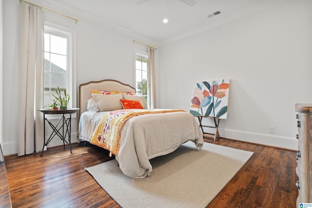 bedroom featuring dark hardwood / wood-style flooring and ceiling fan