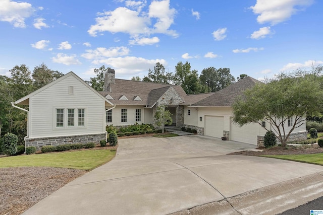 view of front of home with a front lawn and a garage