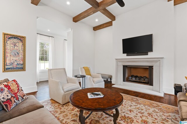 kitchen featuring a center island with sink, pendant lighting, sink, and range hood