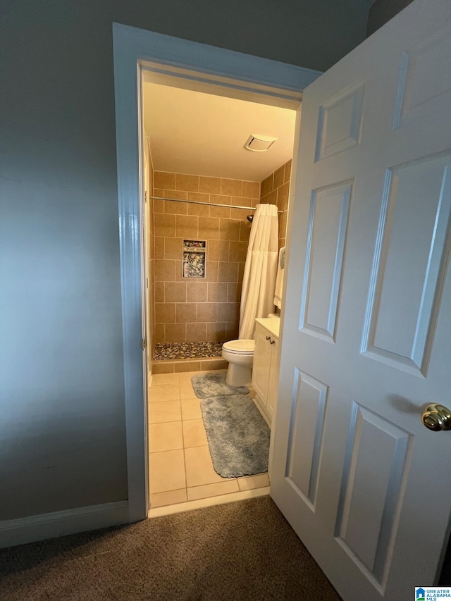 bathroom with vanity, toilet, tile patterned floors, and a shower with shower curtain