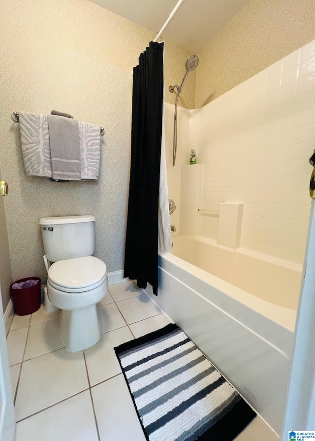 bathroom with toilet, shower / bath combination with curtain, and tile patterned floors