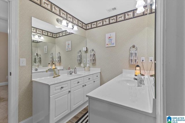 bathroom featuring vanity and wood-type flooring