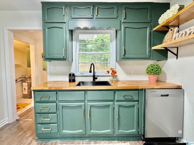 kitchen featuring light wood-type flooring, green cabinets, sink, and stainless steel dishwasher