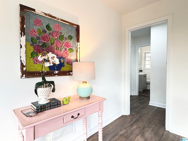 hallway with dark hardwood / wood-style floors