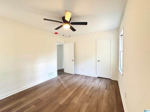 unfurnished bedroom featuring wood-type flooring and ceiling fan