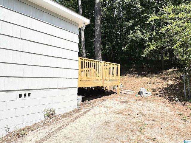 view of side of home with a deck