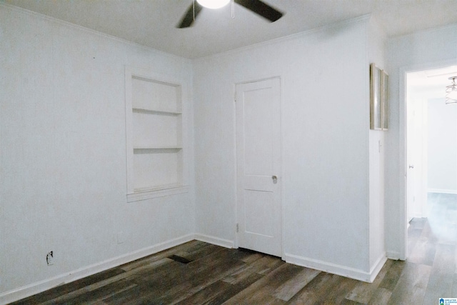 interior space featuring ornamental molding, dark hardwood / wood-style flooring, and ceiling fan