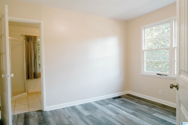 empty room with dark hardwood / wood-style floors