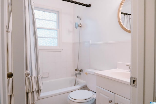 full bathroom with shower / bath combo, vanity, and toilet