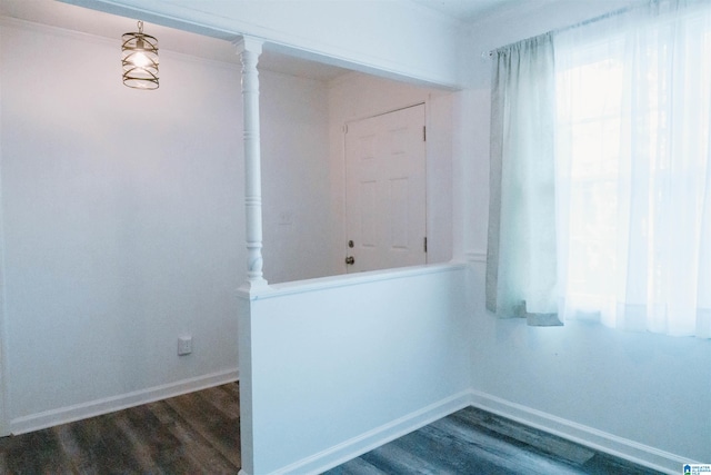 spare room featuring dark wood-type flooring