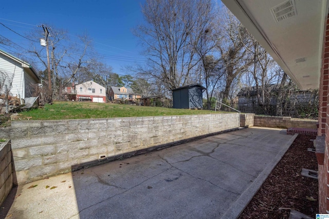 view of patio / terrace featuring a shed