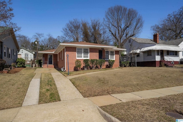 view of front of property with a porch and a front yard