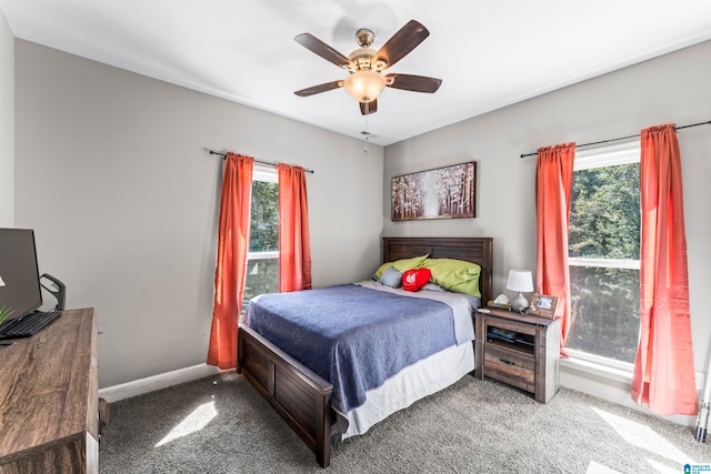 bedroom with multiple windows, carpet flooring, and ceiling fan