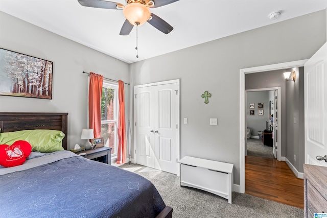 bedroom featuring ceiling fan, hardwood / wood-style flooring, and a closet