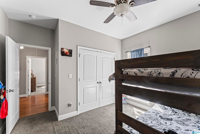 bedroom featuring carpet floors, ceiling fan, and a closet