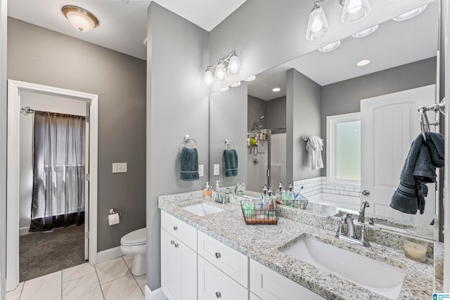 full bathroom featuring independent shower and bath, vanity, and toilet