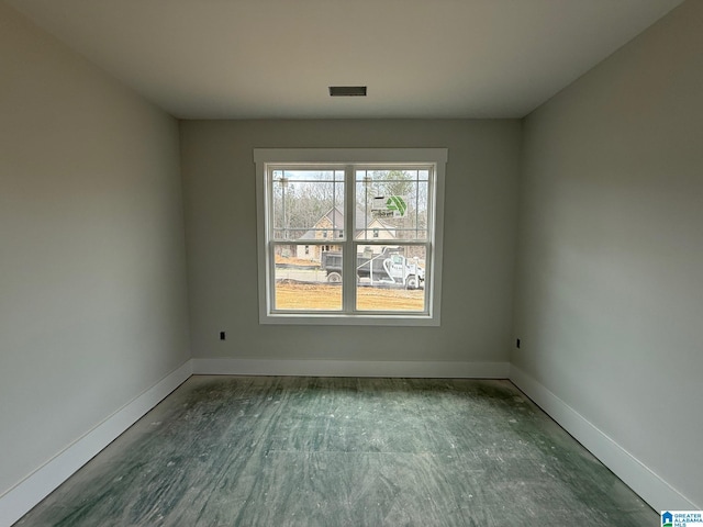 spare room with visible vents and baseboards