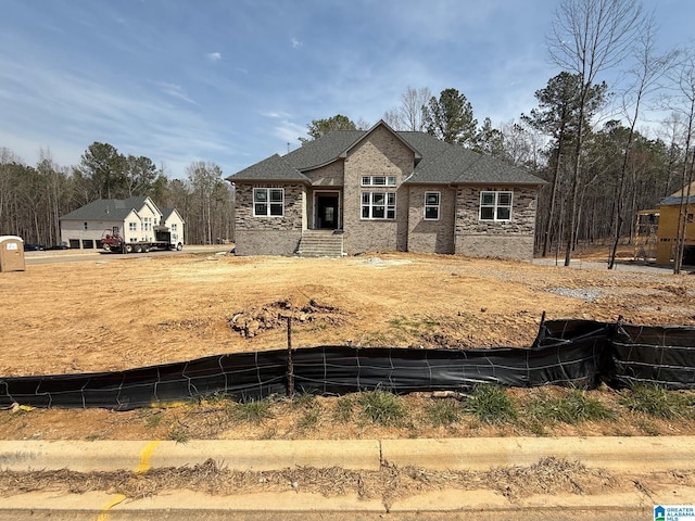 view of front of property with a shingled roof