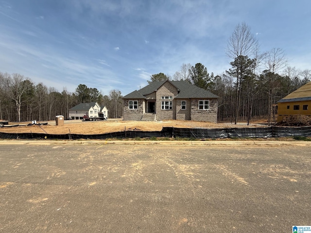 view of front of property featuring fence