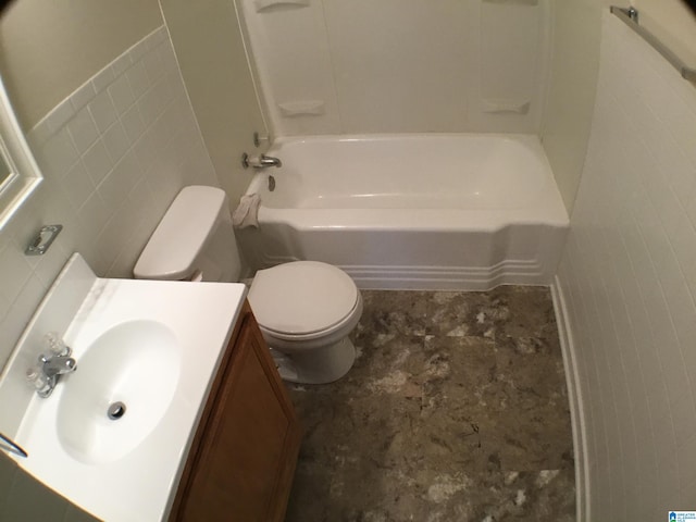 full bathroom with vanity, tile walls, bathing tub / shower combination, and toilet