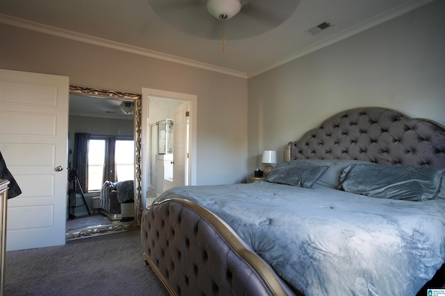 carpeted bedroom featuring ornamental molding, ensuite bath, and ceiling fan