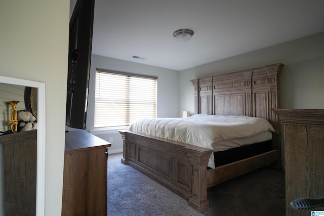 bedroom with dark carpet