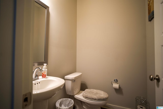 bathroom featuring toilet and sink