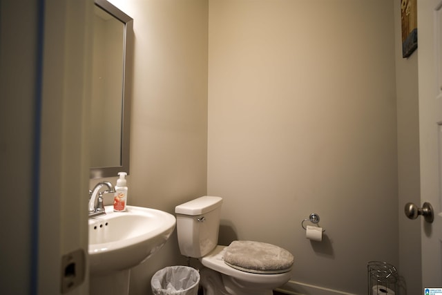 617 Windmill Cir, Helena, AL 35080 - bathroom with a sink, toilet, and baseboards
