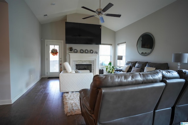 unfurnished living room with dark hardwood / wood-style floors, high vaulted ceiling, a fireplace, and ceiling fan