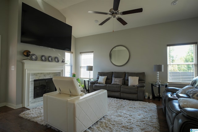 living room with lofted ceiling, ceiling fan, a fireplace, and dark hardwood / wood-style flooring