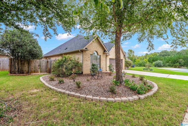 view of home's exterior with a yard and a garage