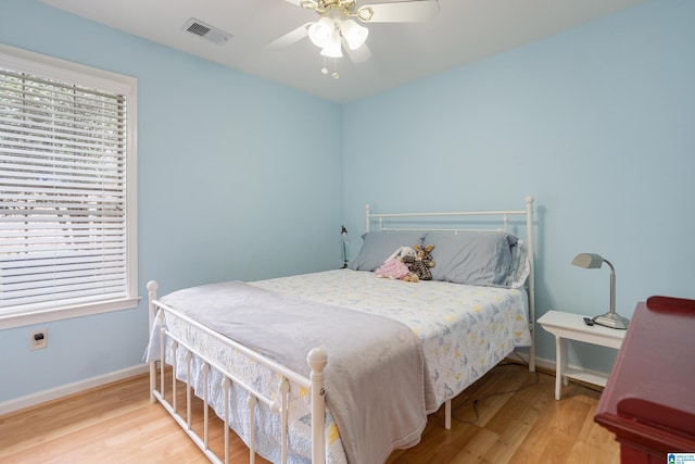 bedroom featuring ceiling fan and hardwood / wood-style floors