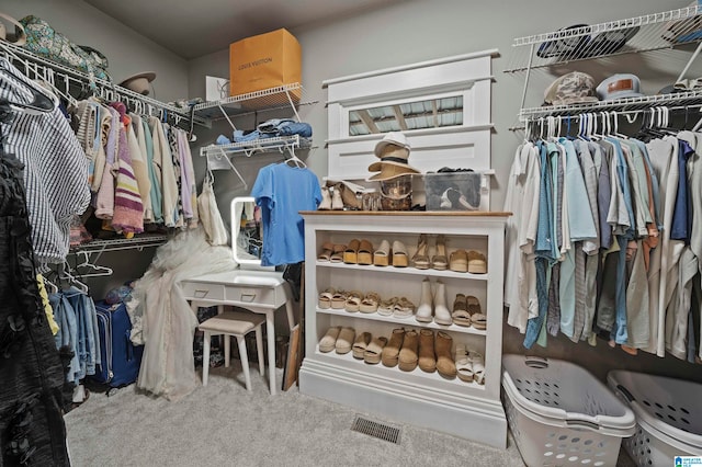 spacious closet with carpet flooring