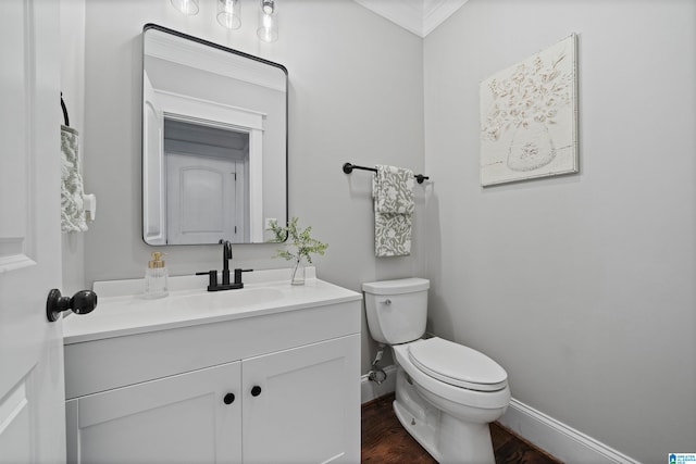 bathroom featuring hardwood / wood-style floors, vanity, and toilet