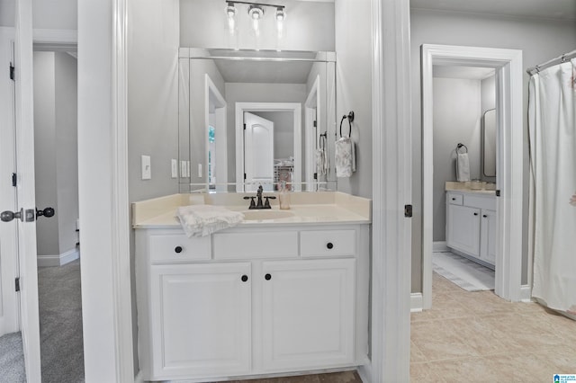 bathroom featuring tile patterned floors and vanity