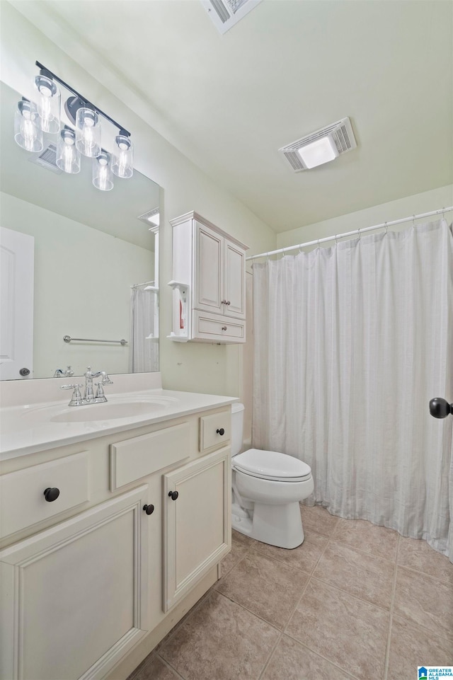 bathroom featuring tile patterned flooring, vanity, toilet, and a shower with curtain