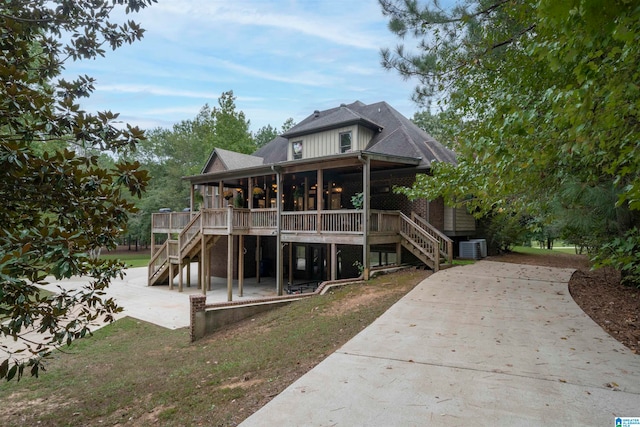 rear view of property with a patio area and a deck