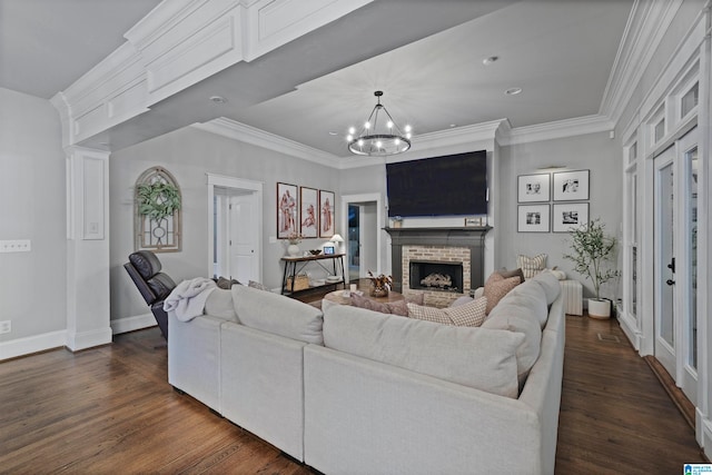 living room with a brick fireplace, crown molding, radiator, dark hardwood / wood-style floors, and a notable chandelier