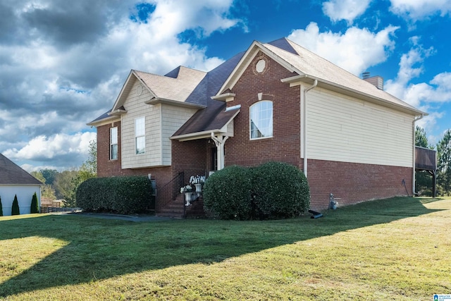 view of side of home with a lawn