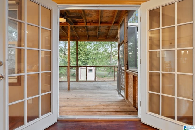 doorway with wood ceiling, wood-type flooring, and a wealth of natural light