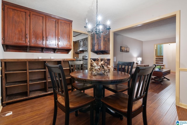 dining room featuring an inviting chandelier, stairway, and dark wood-type flooring
