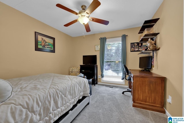 bedroom with light colored carpet and ceiling fan