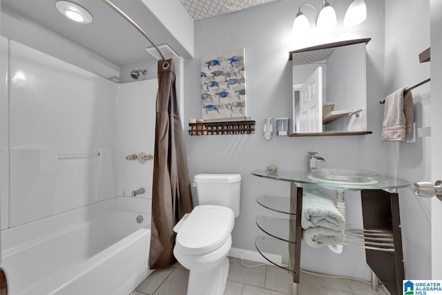 bathroom featuring tile patterned flooring, shower / bath combination with curtain, and toilet