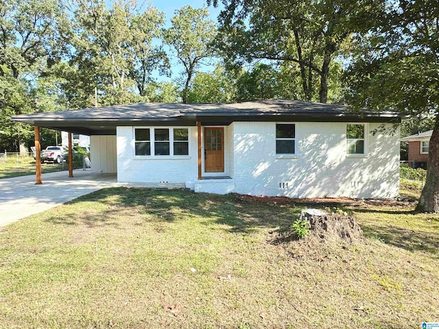 ranch-style home with a front yard and a carport